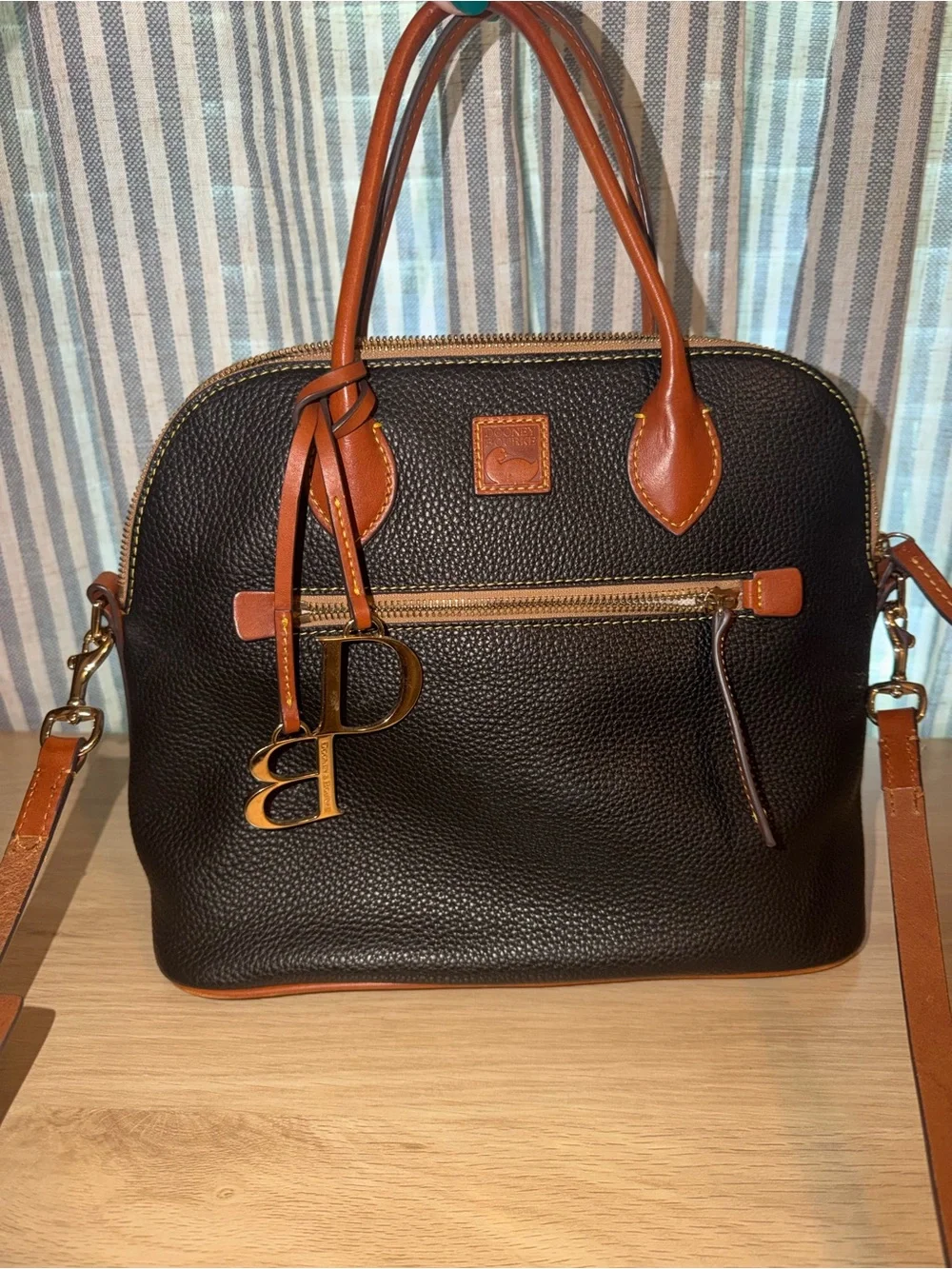 Dooney & Bourke Black Pebbled Leather Satchel with Tan Trim